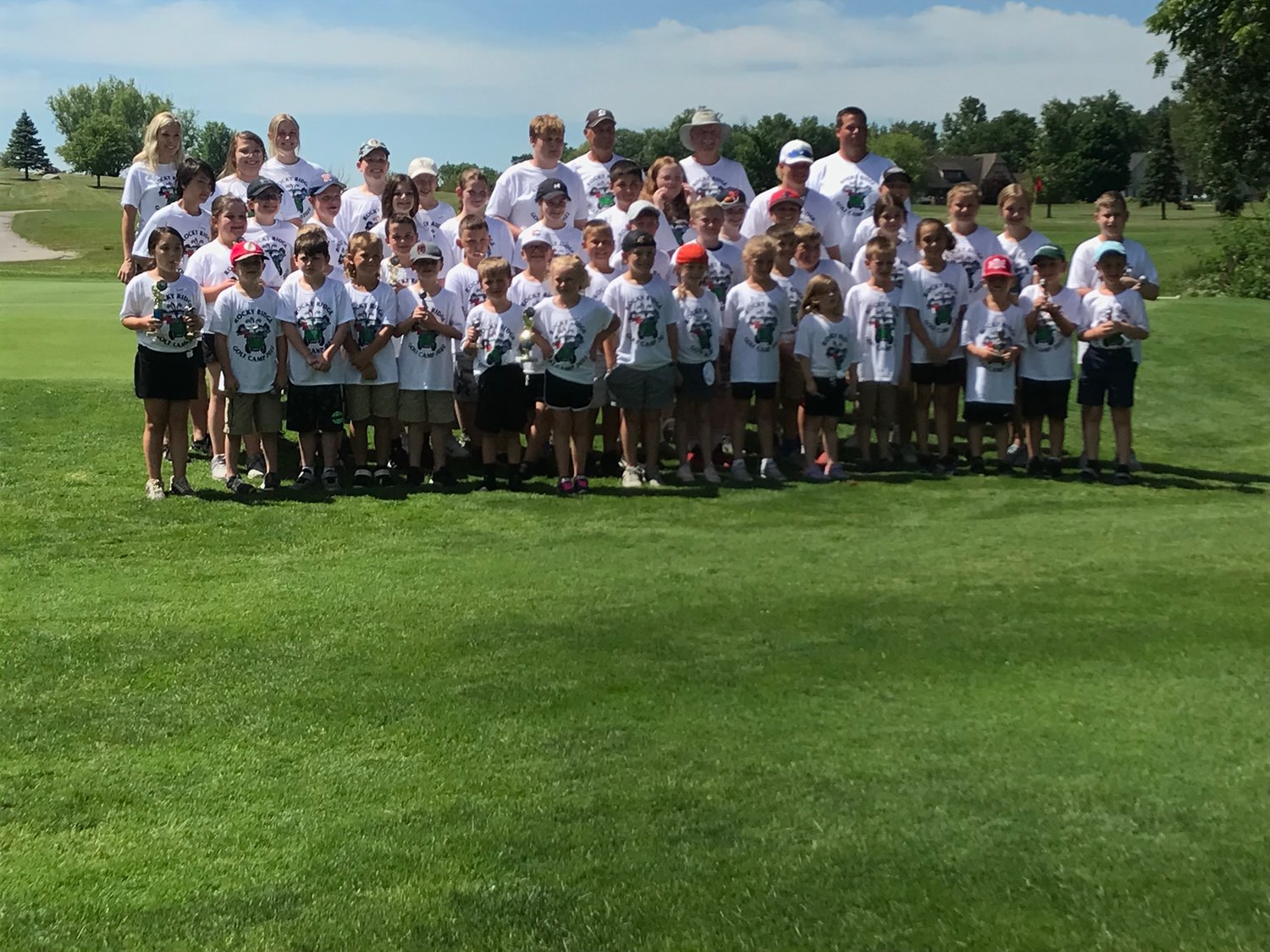 A group photo is taken of all the campers at the annual Rocky Ridge Golf Camp.